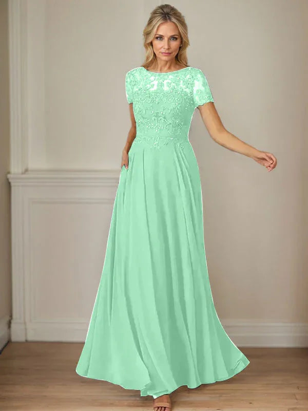 فستان شيفون كحلي داكن برقبة قارب وتطريز بالترتر على شكل حرف A