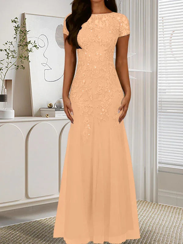 فستان تول مزين بحراشف لامعة برقبة دائرية بلون كحلي داكن على شكل حورية البحر