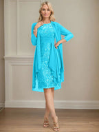 Abito da madre della sposa in pizzo e chiffon con gonna a colonna a effetto illusion fino al ginocchio, con balze a cascata e paillettes