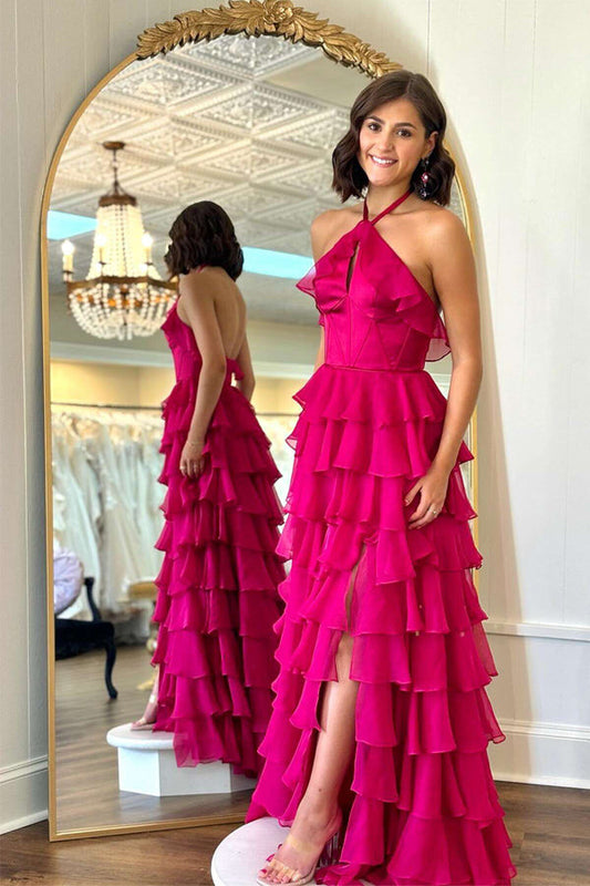 Hermoso vestido de fiesta largo fucsia con volantes y cuello halter