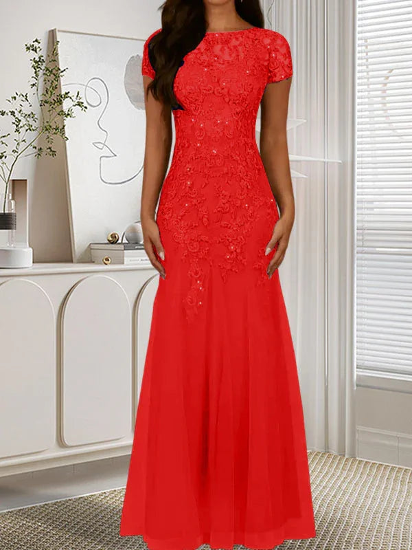 فستان تول مزين بحراشف لامعة برقبة دائرية بلون كحلي داكن على شكل حورية البحر