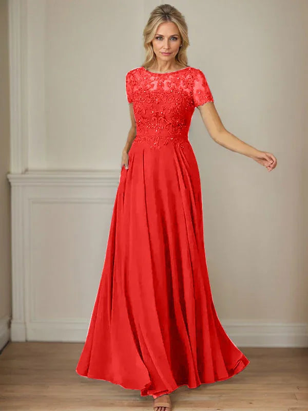 فستان شيفون كحلي داكن برقبة قارب وتطريز بالترتر على شكل حرف A