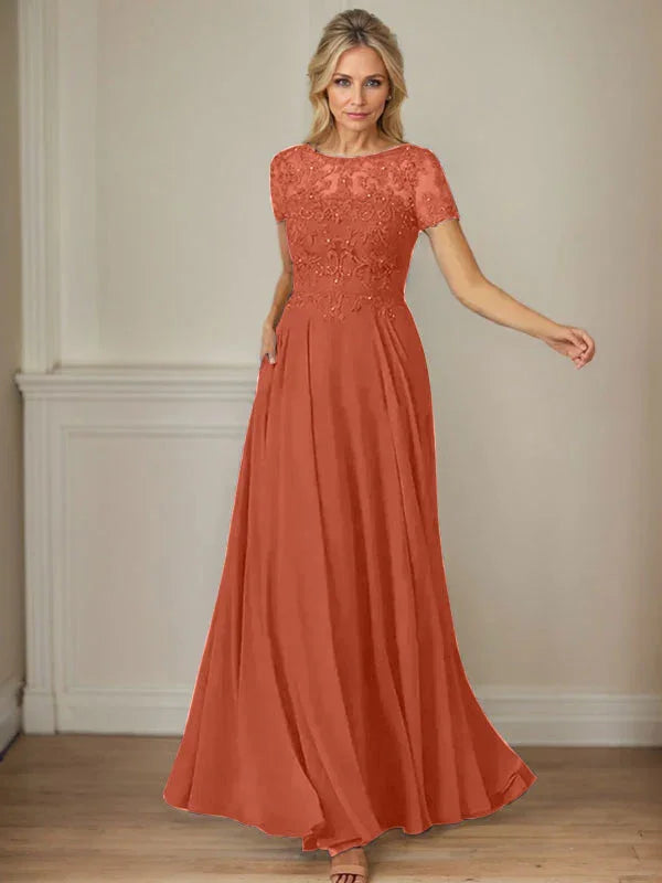 فستان شيفون كحلي داكن برقبة قارب وتطريز بالترتر على شكل حرف A