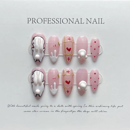 10 uñas postizas de conejo blanco hechas a mano, color almendra rosa, con rayas doradas y decoración de corazón, ideales para usar. 