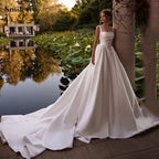 Custom Satin A Line Wedding Dress With Spaghetti Strap And Boat Neck