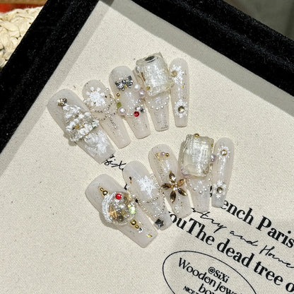 10 uñas postizas navideñas hechas a mano, brillantes, blancas y plateadas, con diseño de copos de nieve y lazos, para manicura suave y fácil de usar. 