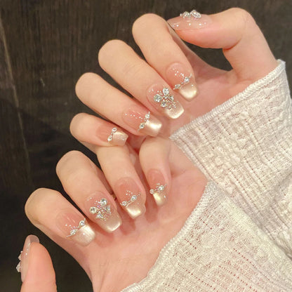 10 uñas postizas con diseño de ojos de gato y diamantes de imitación, de larga duración, seguras e impermeables, ideales para ir de compras, viajar y citas. 