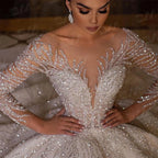 Vestidos de novia sexys con cuentas Vestidos de novia de lujo con cuentas hechas a mano Vestido de boda de manga larga Vestido de baile con cola larga de capilla