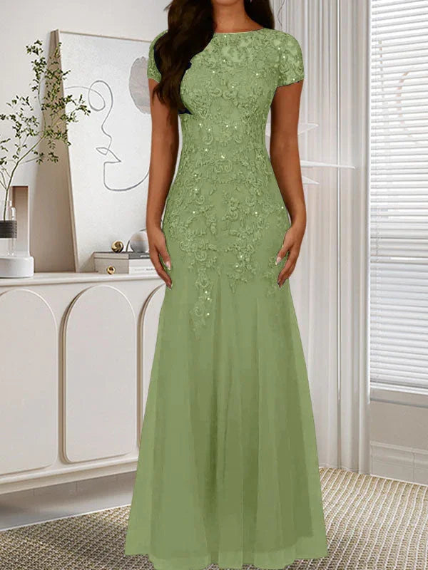 فستان تول مزين بحراشف لامعة برقبة دائرية بلون كحلي داكن على شكل حورية البحر