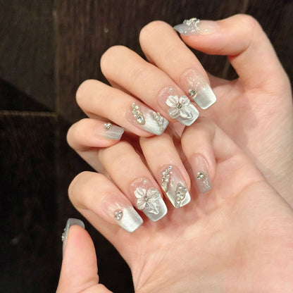 10 uñas postizas 3D talladas a mano con diseño de flor de hielo, color azul claro, estilo francés, estilo ojo de gato, hechas a mano, con encanto, para usar. 