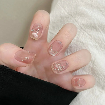 10 uñas postizas cortas y redondas, hechas a mano, estilo francés, color rosa, con diseño de ojo de gato y diamantes de imitación de perla. 
