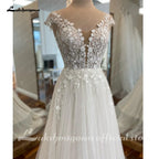 Customized A Line Off White Tulle Bridal Beach Wedding Dress With Cap Sleeves