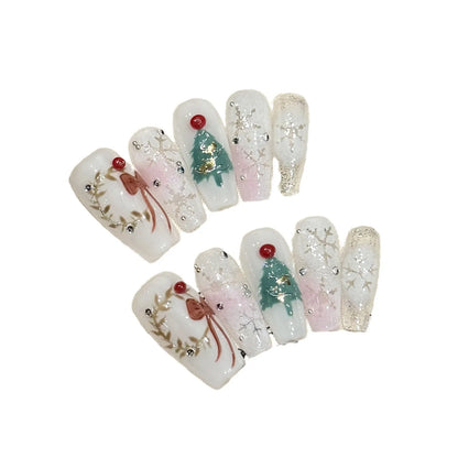 10 uñas postizas navideñas hechas a mano, brillantes, blancas y plateadas, con diseño de copos de nieve y lazos, para manicura suave y fácil de usar. 