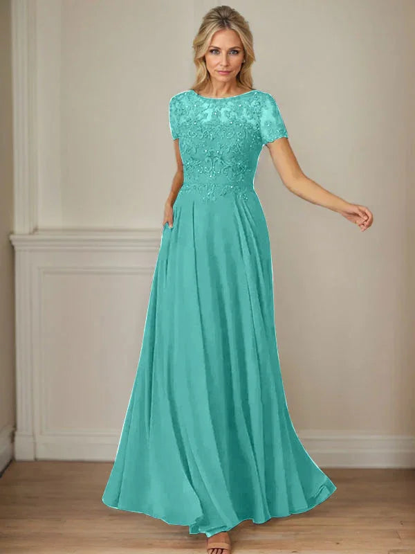 فستان شيفون كحلي داكن برقبة قارب وتطريز بالترتر على شكل حرف A