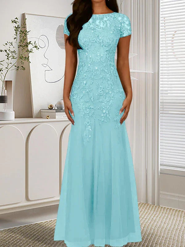 فستان تول مزين بحراشف لامعة برقبة دائرية بلون كحلي داكن على شكل حورية البحر