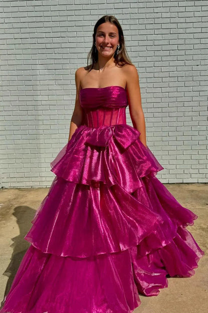 Vestido de fiesta largo fucsia con corsé, corte A y abertura, sin tirantes