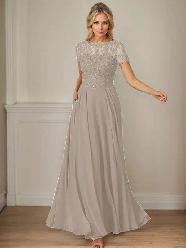 فستان شيفون كحلي داكن برقبة قارب وتطريز بالترتر على شكل حرف A