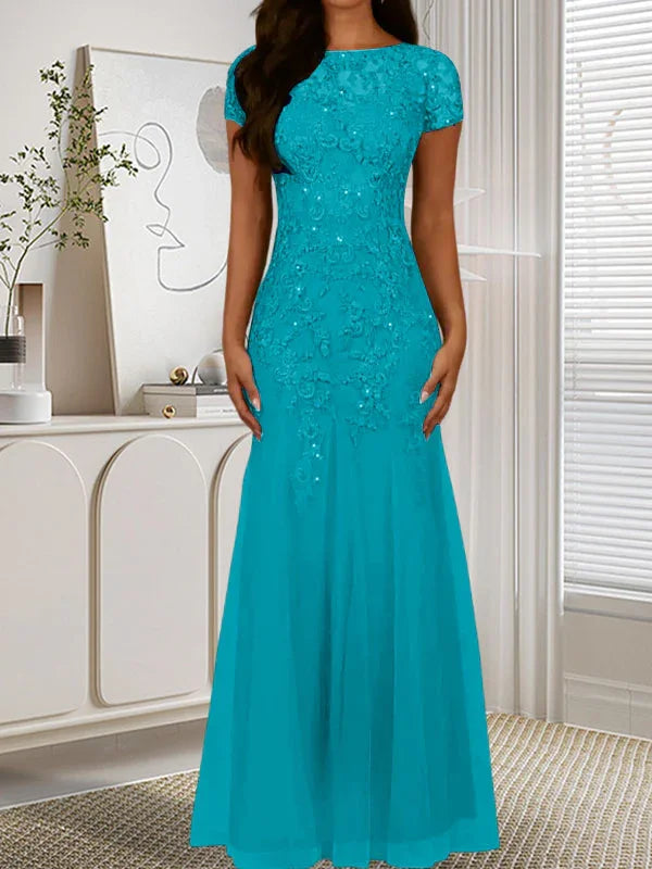 فستان تول مزين بحراشف لامعة برقبة دائرية بلون كحلي داكن على شكل حورية البحر