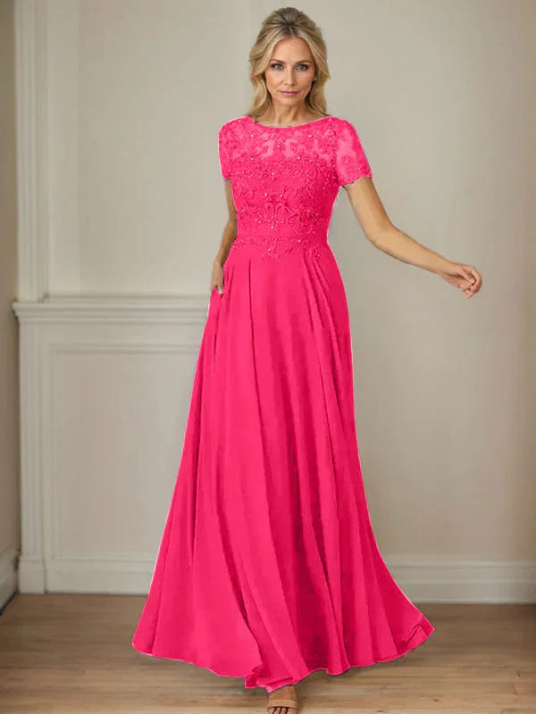 فستان شيفون كحلي داكن برقبة قارب وتطريز بالترتر على شكل حرف A