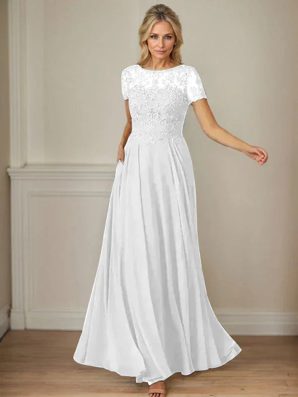 فستان شيفون كحلي داكن برقبة قارب وتطريز بالترتر على شكل حرف A