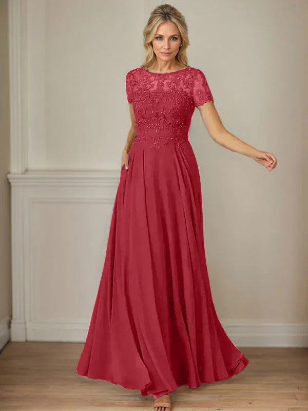 فستان شيفون كحلي داكن برقبة قارب وتطريز بالترتر على شكل حرف A