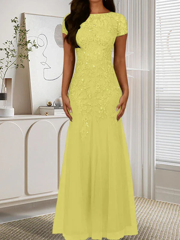 فستان تول مزين بحراشف لامعة برقبة دائرية بلون كحلي داكن على شكل حورية البحر