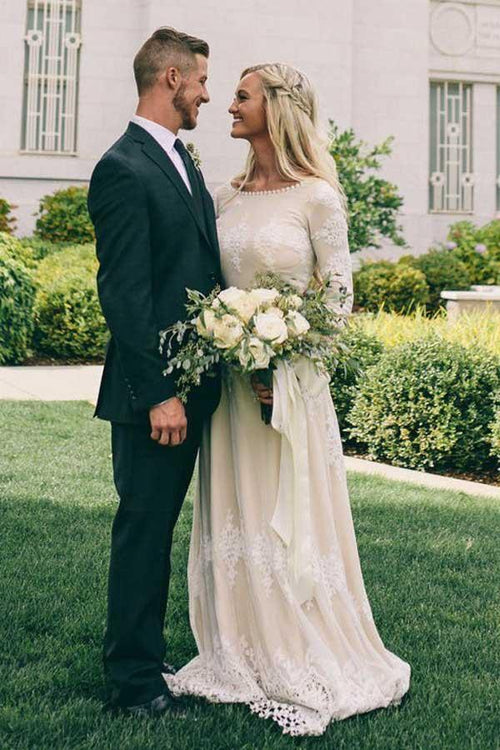 Abito da sposa in tulle avorio a linea A con scollo a barca e maniche lunghe, decorato con applicazioni