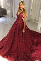 Abito da sera bordeaux con scollo a V, spalle scoperte e paillettes, linea a trapezio