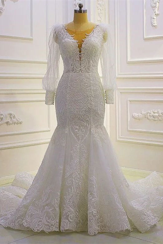 Hermoso vestido de novia de sirena con mangas largas y apliques de encaje y cola