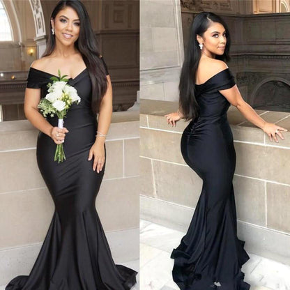 Vestido de fiesta negro de corte sirena, con hombros descubiertos, largo hasta el suelo y espalda descubierta
