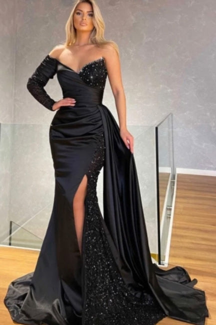 Abito da sera nero con paillettes, monospalla, scollo a cuore, maniche lunghe, lunghezza fino a terra, spacco frontale, modello sirena con strascico