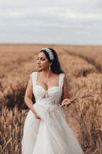 Encantador vestido de novia largo blanco de tul en forma de A, sin mangas y con encaje