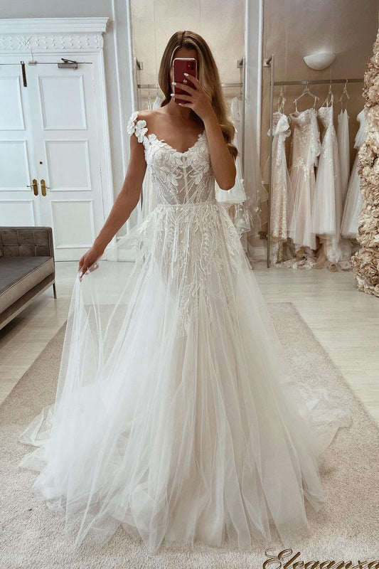 Vestido de noiva chique em tule, sem mangas, com renda e comprimento até o chão
