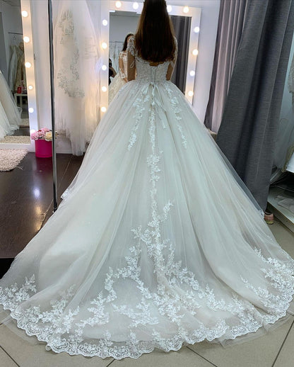 Vestido de novia elegante de tul con encaje, apliques de princesa y mangas largas