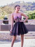 Vestito corto da rientro a casa in tulle a pois con corsetto