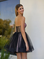 Vestito corto da rientro a casa in tulle a pois con corsetto