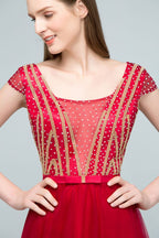 Vestidos de cerimónia com tule bordado a cristal, corte evasê, comprimento até ao chão, mangas curtas tipo capa e faixa na cintura