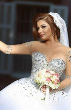 فساتين زفاف مصممة بأكمام | فساتين زفاف فاخرة على طريقة الأميرات