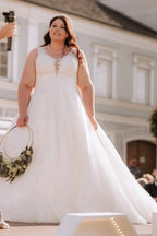 Dreamy Ivory V-Neck Sleeveless Ball Gown Wedding Dress with Appliques and Chapel Train