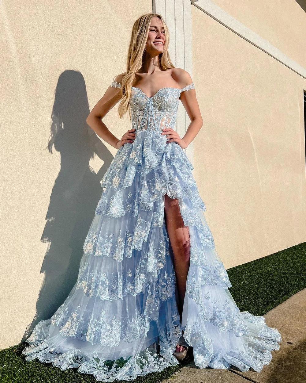 Capri | Abito da sera azzurro con paillettes cristallo, linea a principessa, scollatura a spalle scoperte e balze di pizzo