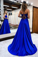 Elegante vestido de fiesta largo de satén con escote halter, abertura frontal, espalda descubierta y bolsillos