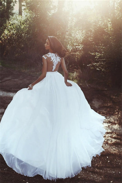 Elegantes vestidos de novia con encaje de gasa hasta el suelo.