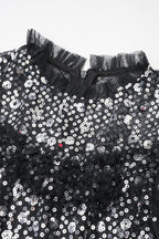 Abito da sera lungo in tulle a balze con collo alto finto, balze a pois e paillettes scintillanti