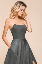 Abito lungo da sera scintillante senza spalline e con schiena scoperta e spacco