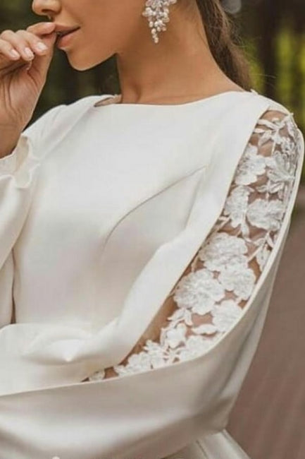 فستان زفاف أبيض ساتان طويل الأكمام بقصة على شكل حرف A مزين بالتطريزات