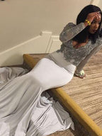 Splendido abito da sera in raso con scollo a V, maniche lunghe e applicazioni a sirena