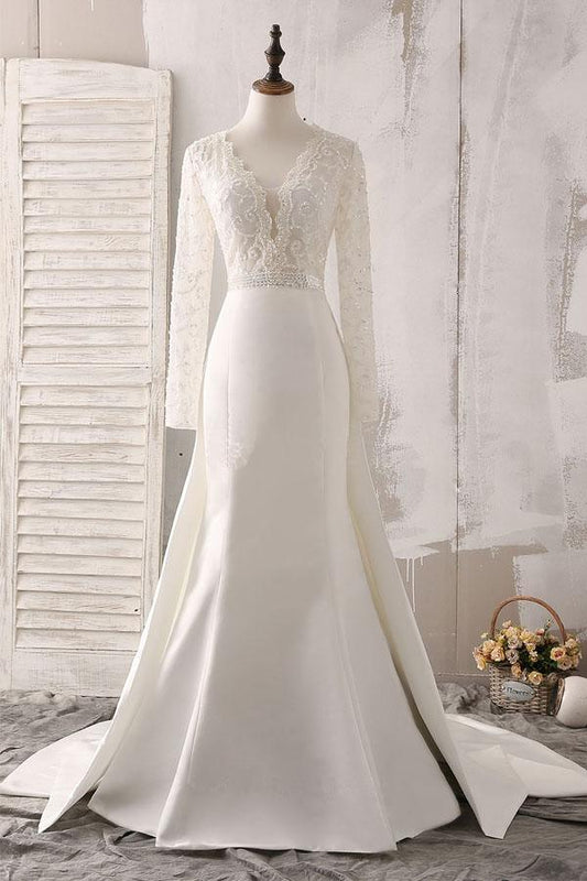 Vestido de novia de encaje color marfil y satén con escote en V, manga larga y cuentas