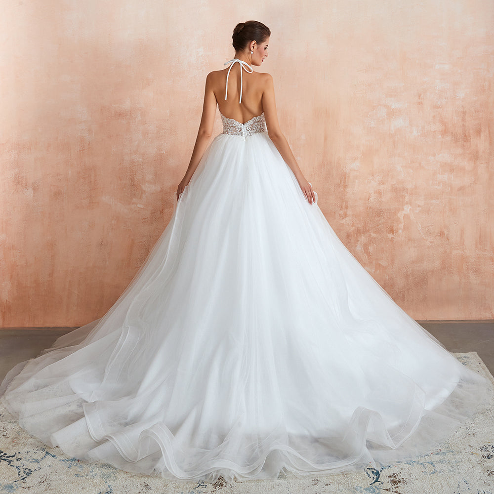 Robe de mariée longue en tulle, coupe trapèze, dos nu avec bretelles nouées et appliques
