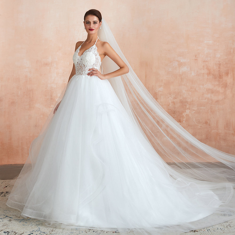 Robe de mariée longue en tulle, coupe trapèze, dos nu avec bretelles nouées et appliques