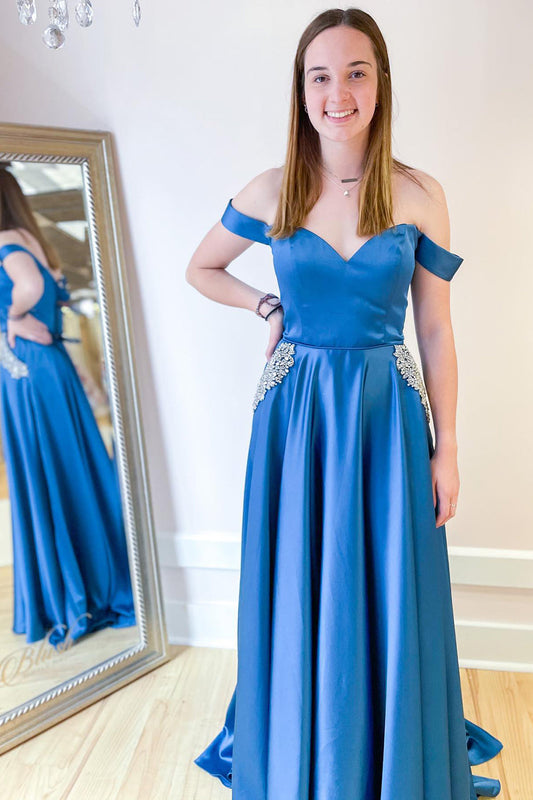 Langes, schulterfreies A-Linien-Ballkleid mit Taschen und Kristallverzierung